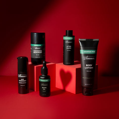 group of mens personal care products in black bottles on red boxes