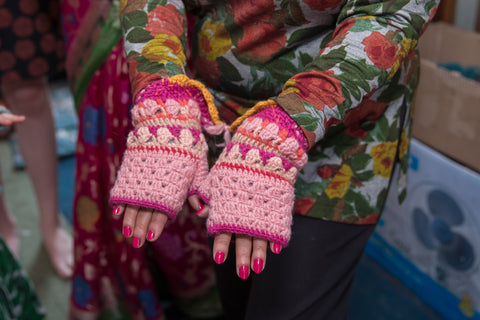 Knitted Handwarmers on A Nepalese Women's Hands