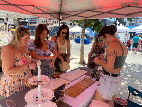 rose burkhardt jewelry booth with shoppers