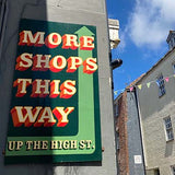 Falmouth old high street sign to more shops
