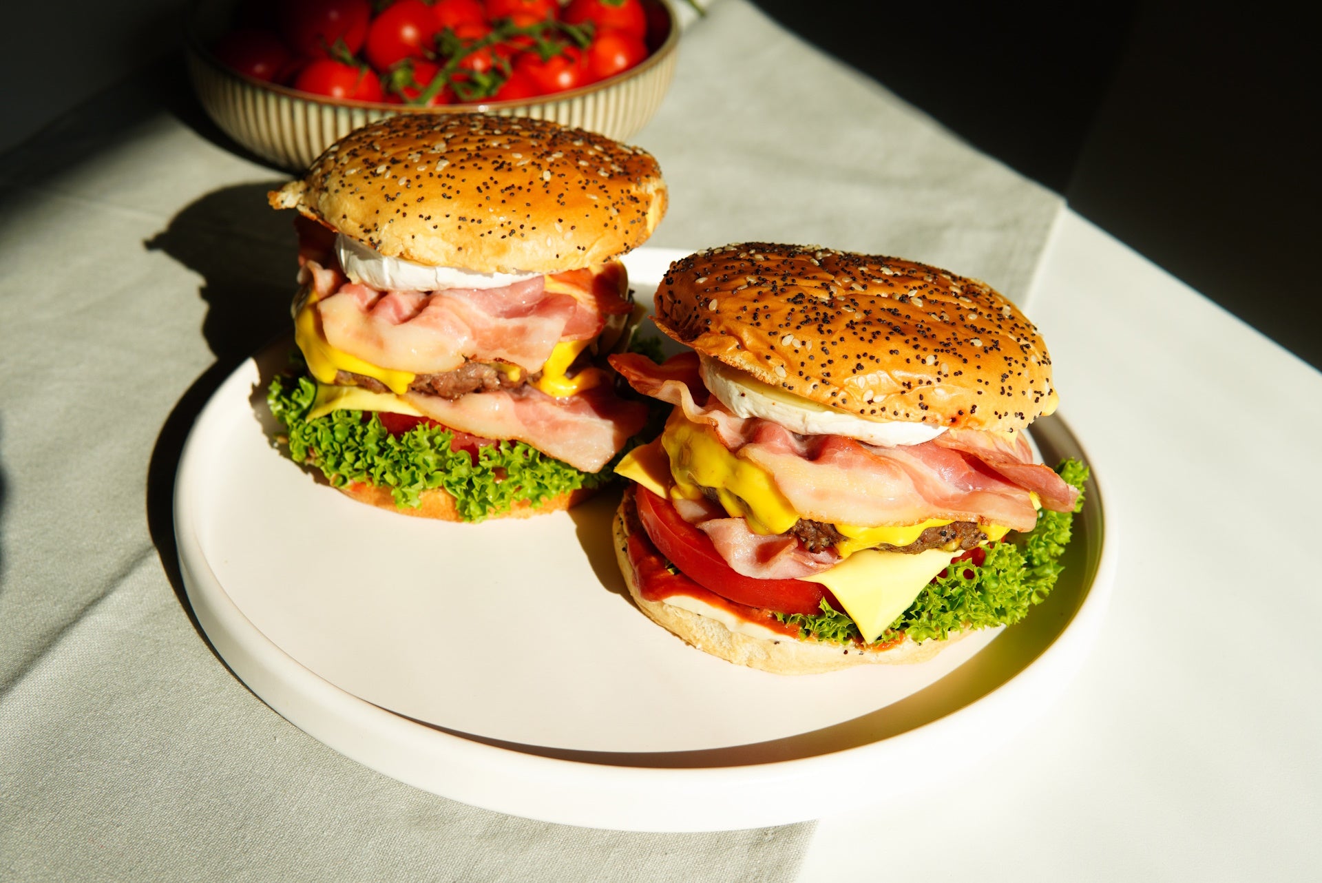 Juicy burgers topped with creamy olive oil aioli, a gourmet treat for the taste buds.