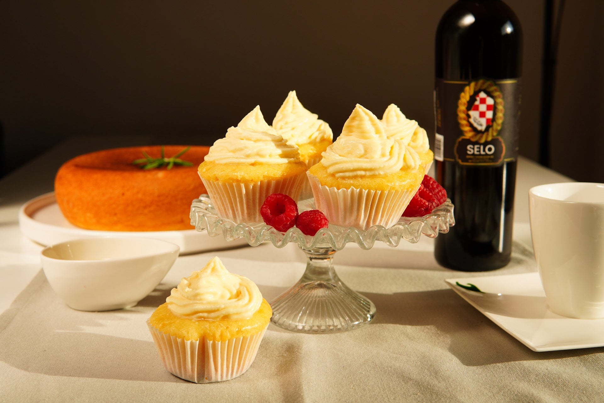 Delicate vanilla cupcakes infused with the goodness of olive oil, a sweet and savory delight.