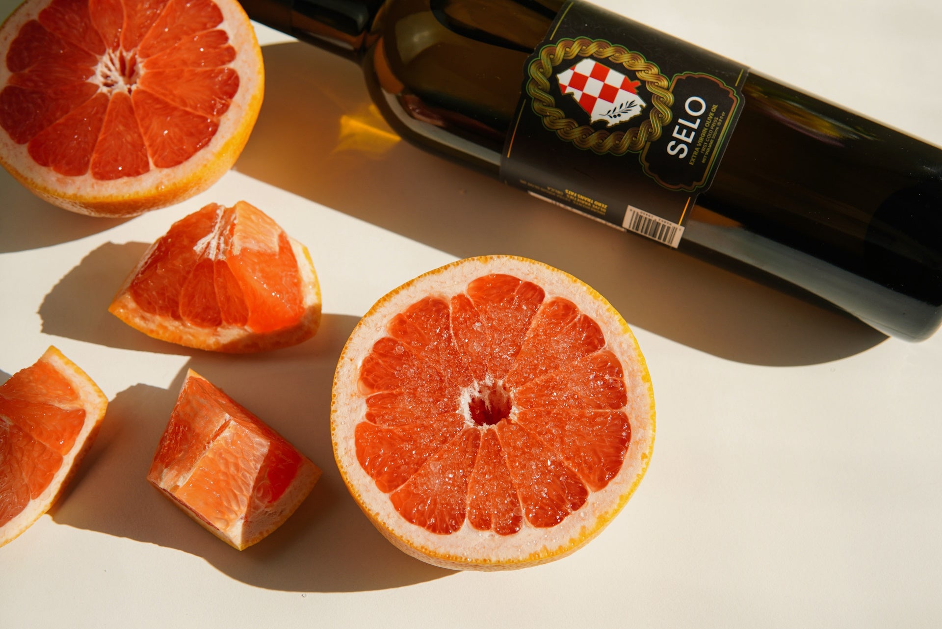 Sliced grapefruit, a tangy and refreshing citrus fruit, with its vibrant pink flesh and juicy segments, offering a delightful summer indulgence.