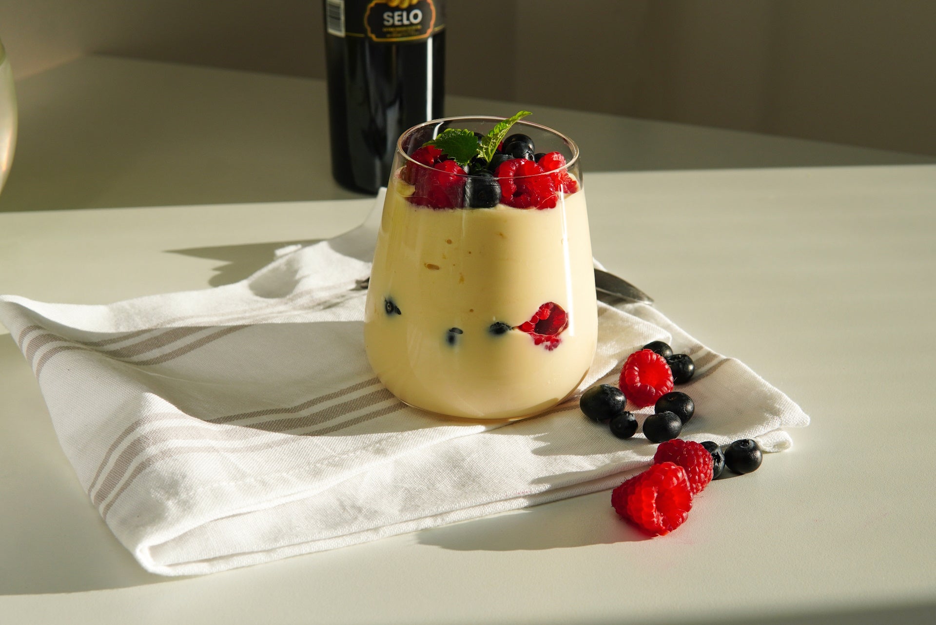 Creamy Greek yoghurt topped with fresh fruit, enhanced with a dash of Croatian olive oil.