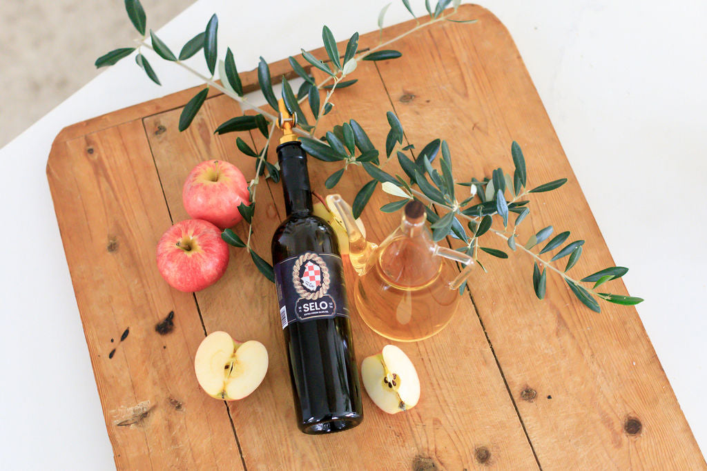 Olive oil and olives: A bottle of olive oil placed next to a bowl filled with fresh, plump olives.