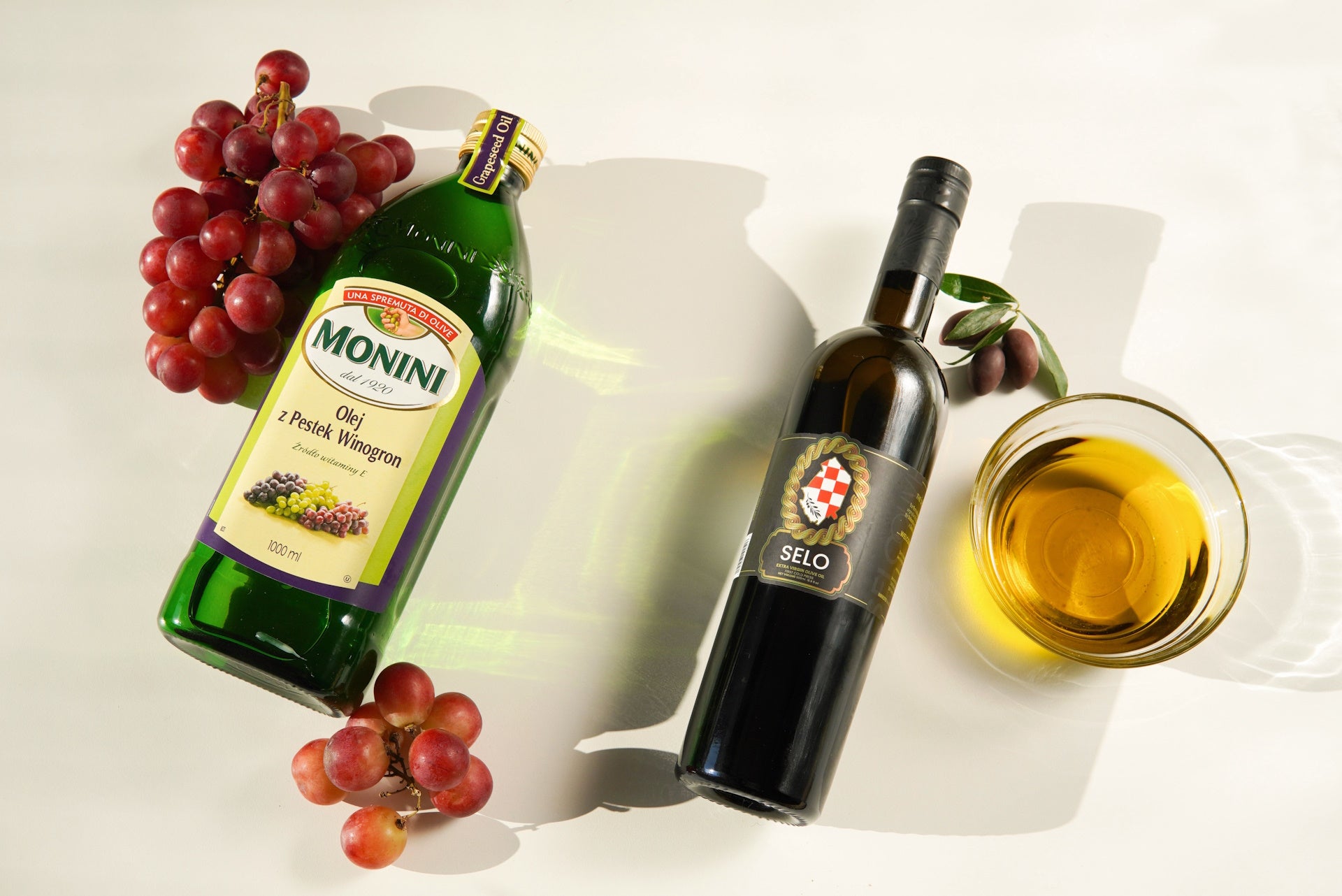 Grapeseed oil bottle placed on a marble countertop, presenting a seamless blend of elegance and natural beauty.