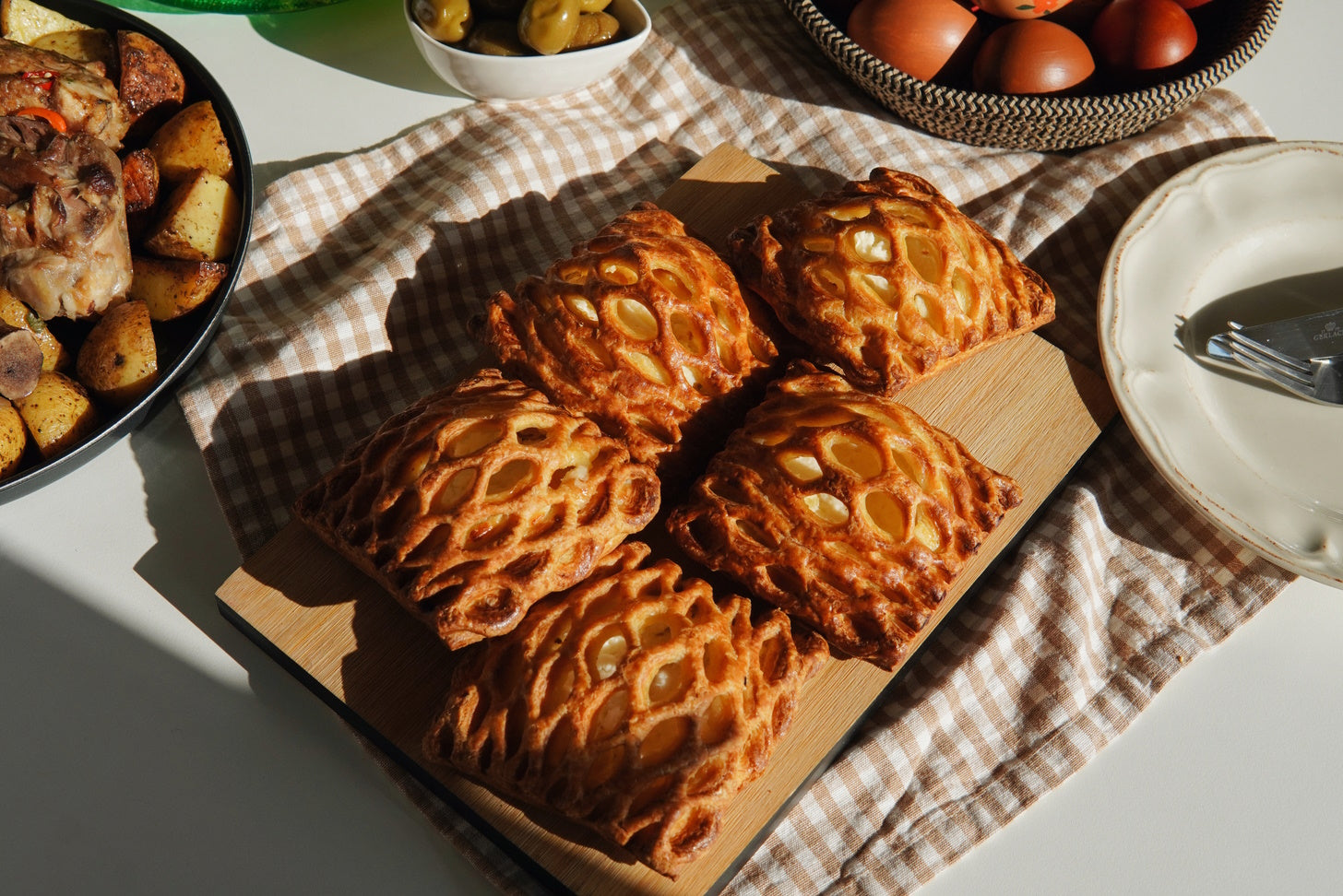 Croatian pastry with a rich gluten texture displayed on a wooden cutting board.