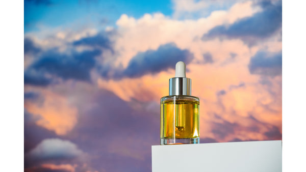 face oil with sky background 