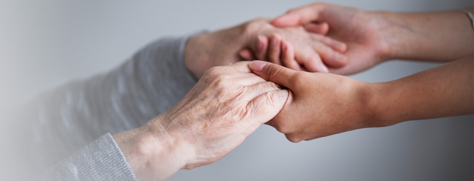 Two adults holding hands