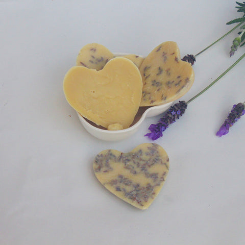 Handmade lotion bars made with coconut oil, cocoa butter, shea butter and lavender essential oil and flowers. 