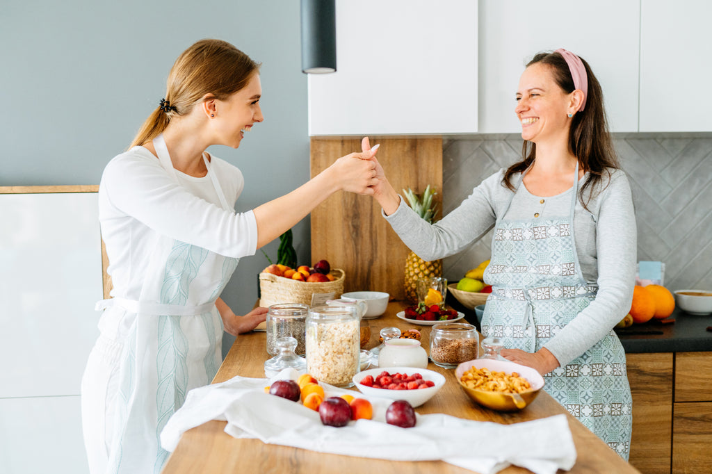 Woman in kitchen smiling