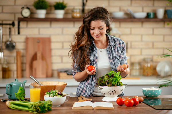 Woman cooking a healthy meal in her kitchen