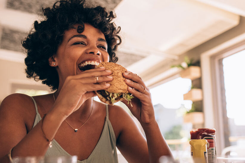 Woman enjoying a veggie burger