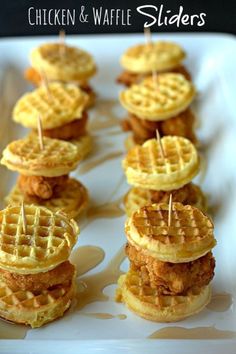 8 brunch sliders on a white plate made from mini Eggo waffles with chicken bites and honey butter