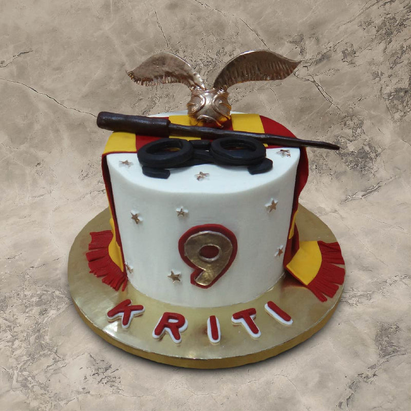 Harry potter gryffindor cake for a potter head who lives in the wonderland of hogwards and is a big fan of harry potter