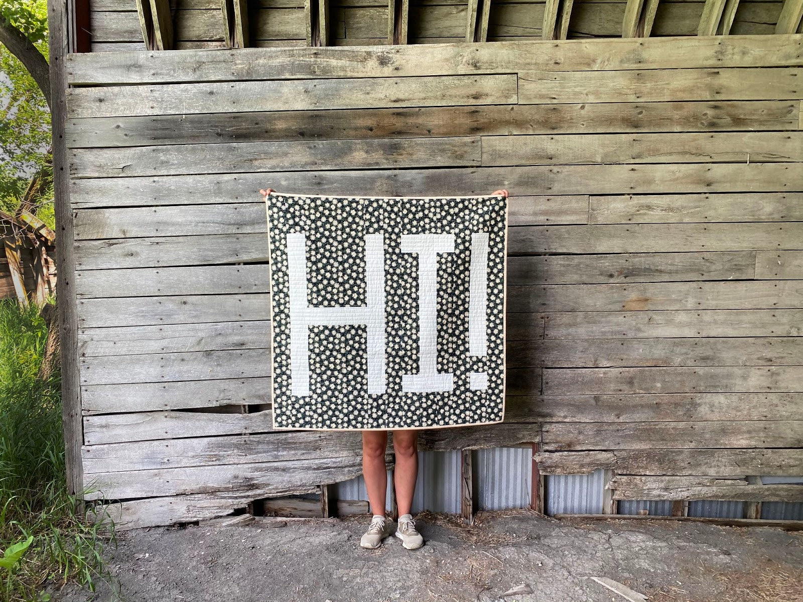 Erin Holding HI Quilt Wood Wall