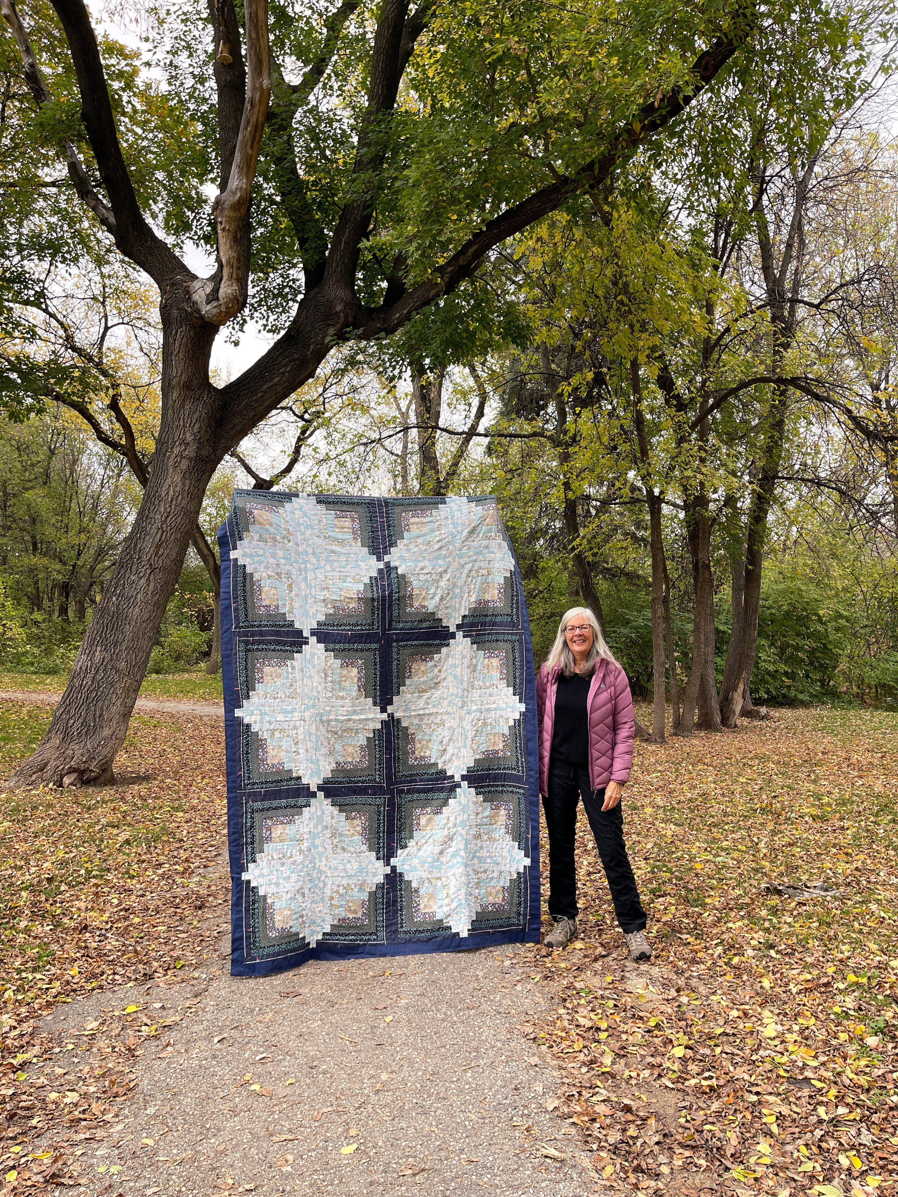 Erin's mom Susan with a Log Cabin Quilt