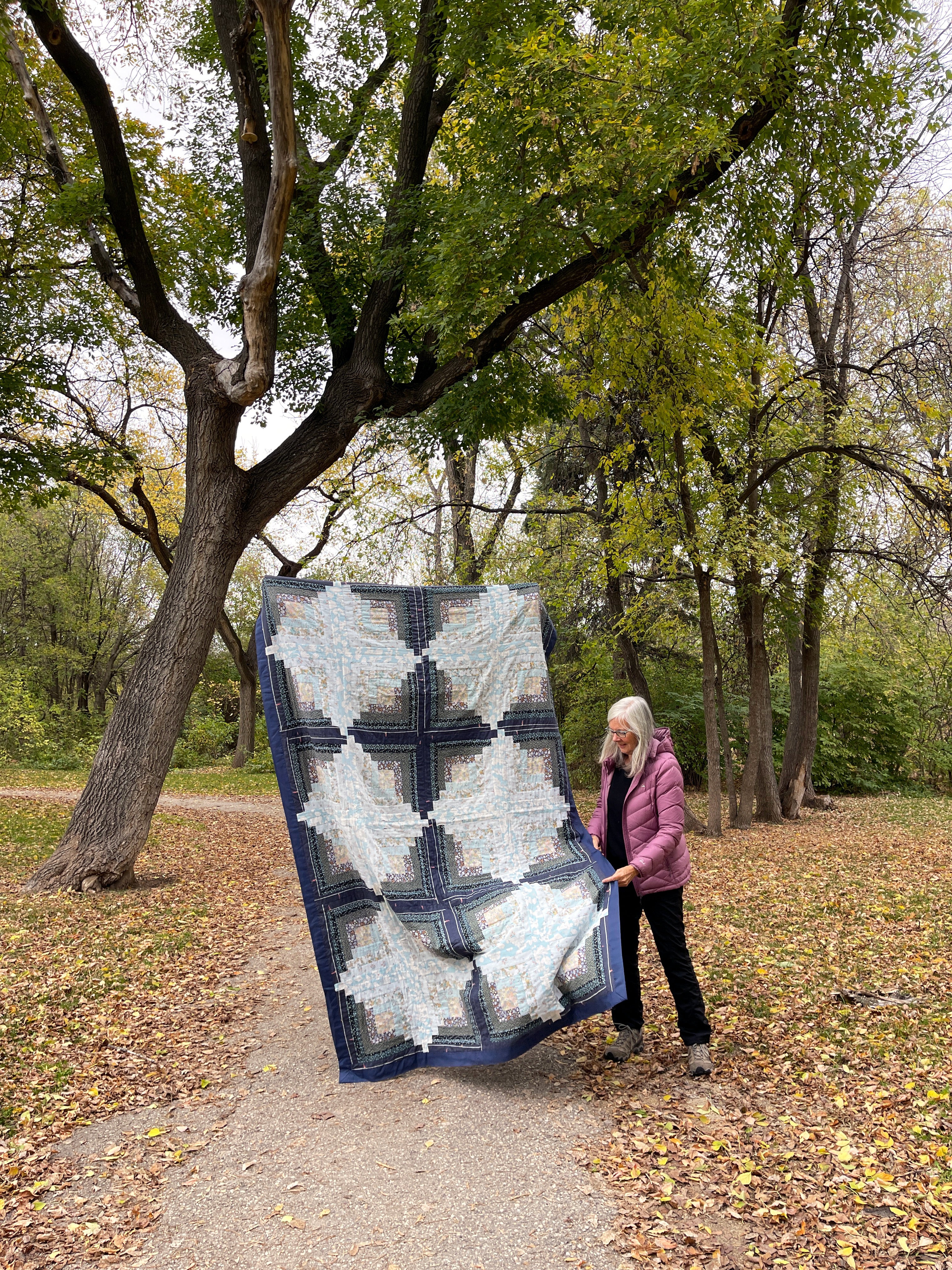 Erin's mom Susan with a Log Cabin Quilt