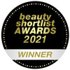 Round badge reading "beauty shortlist awards 2021 winner," featuring a black and gold design with clean Madame Gabriela Lipstick accents.