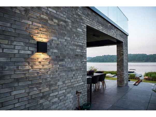 Stylish home exterior with an up and down wall light