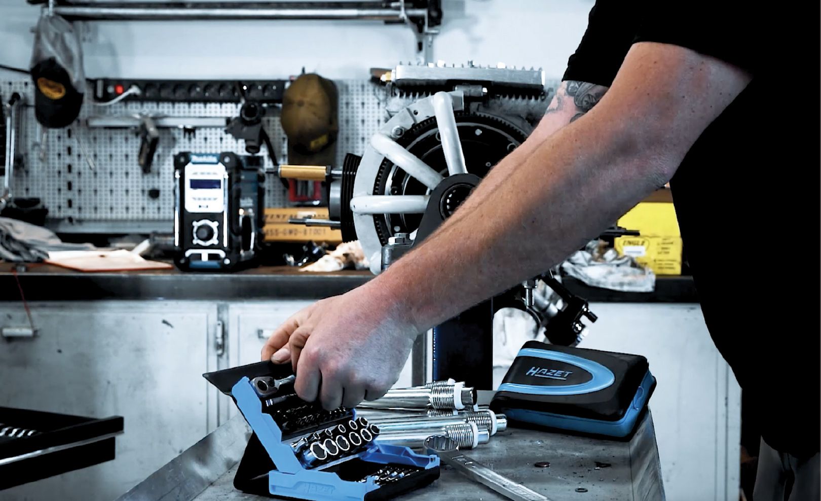 workshop interior, person working with hazet tools