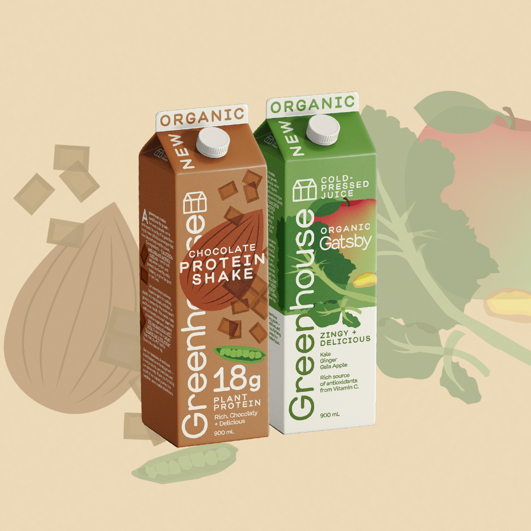 Two cartons of organic beverages, one chocolate protein shake and one cold-pressed juice, with a neutral background.