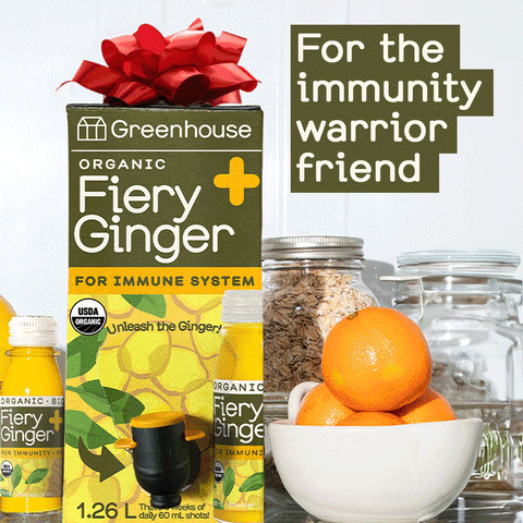 For the immunity warrior friend. Shot Box with a red bow on top sits by a bowl of oranges.
