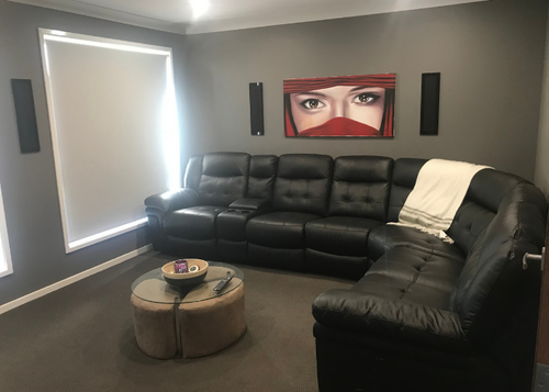 beautiful lounge with sleek in wall speakers