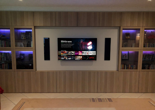 in-wall speaker set up with ambient lighting