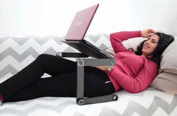 FlexDesk™ Adjustable Portable Laptop Stand For Desk And Bed is the all-in-one solution for computing while relaxing on the couch or lying in bed. It is fully adjustable to meet your desired height for all circumstances, and it can also improve your posture.