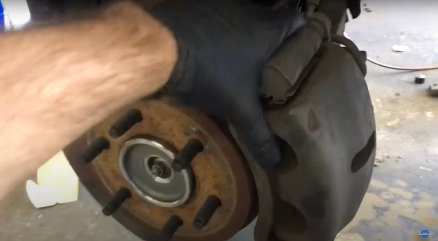 Replacing brake caliper on Ford F-150 wheel