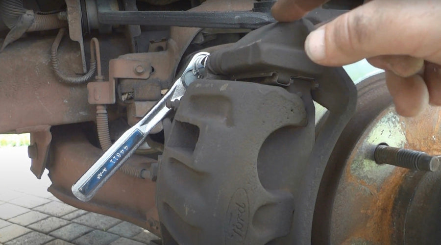 Brake calliper being removed from 1997 Ford F-150
