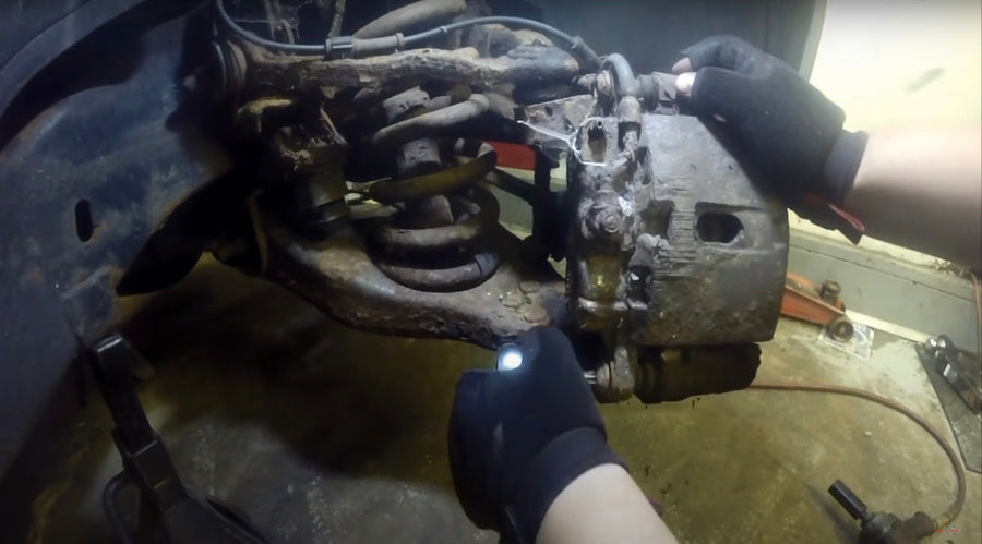 Removing the brake caliper from a generation 1 Chevrolet Silverado 1500