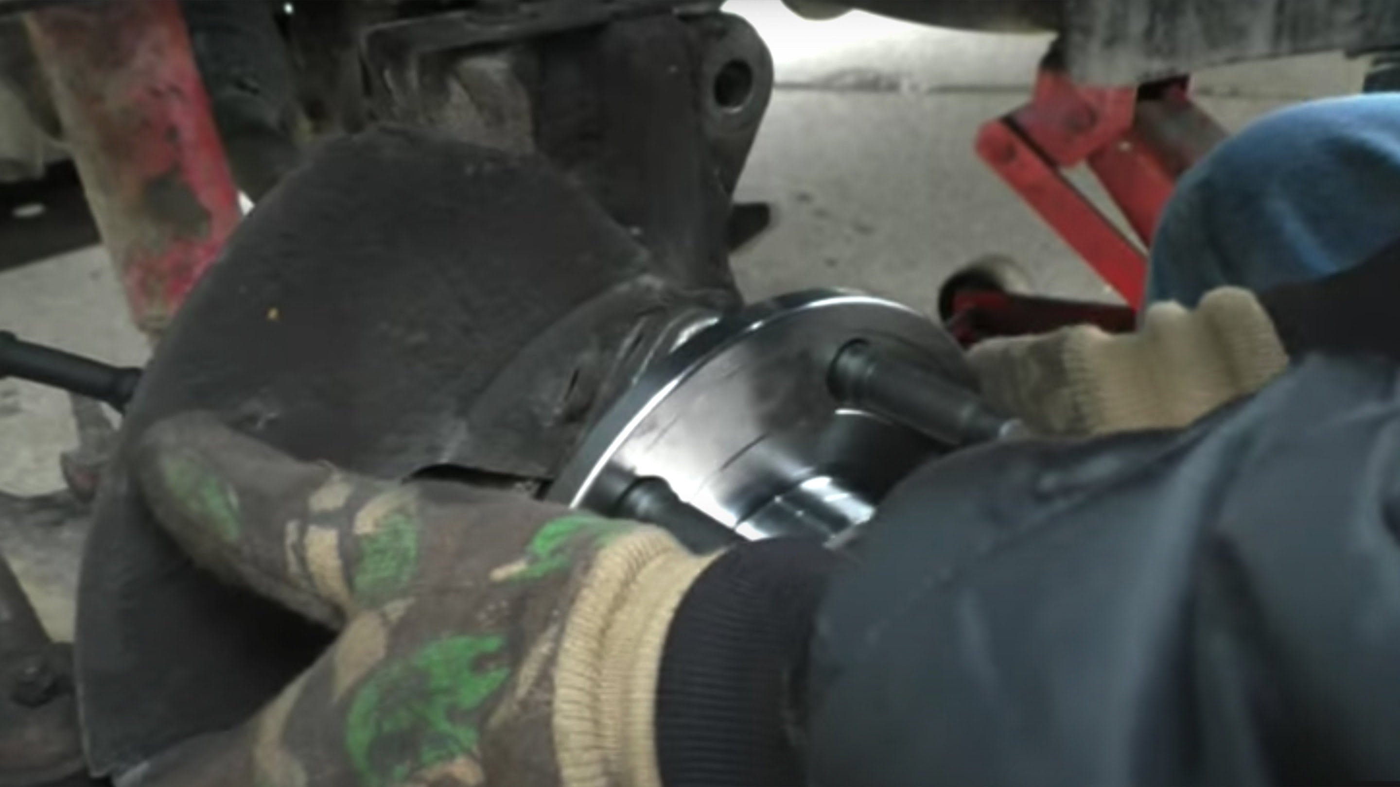 Mechanic installing new hub in 07-13 Chevy Avalanche