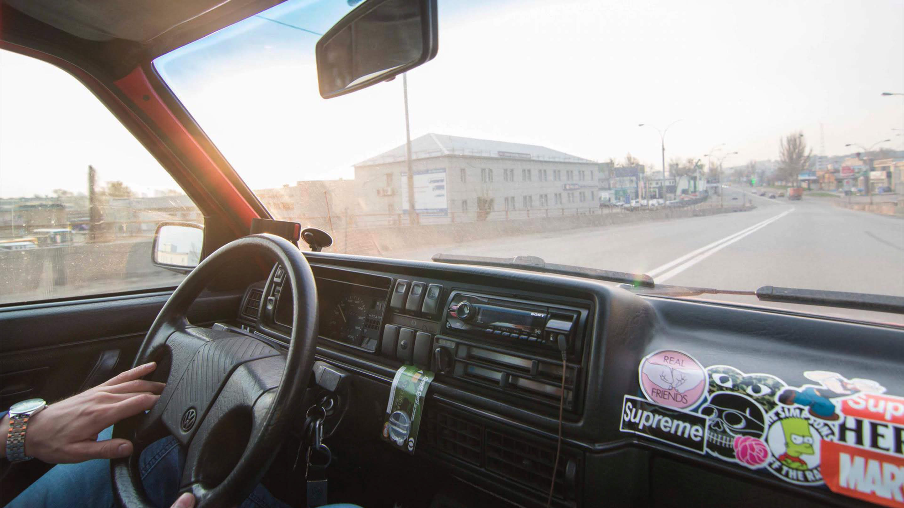 man driving in an older truck