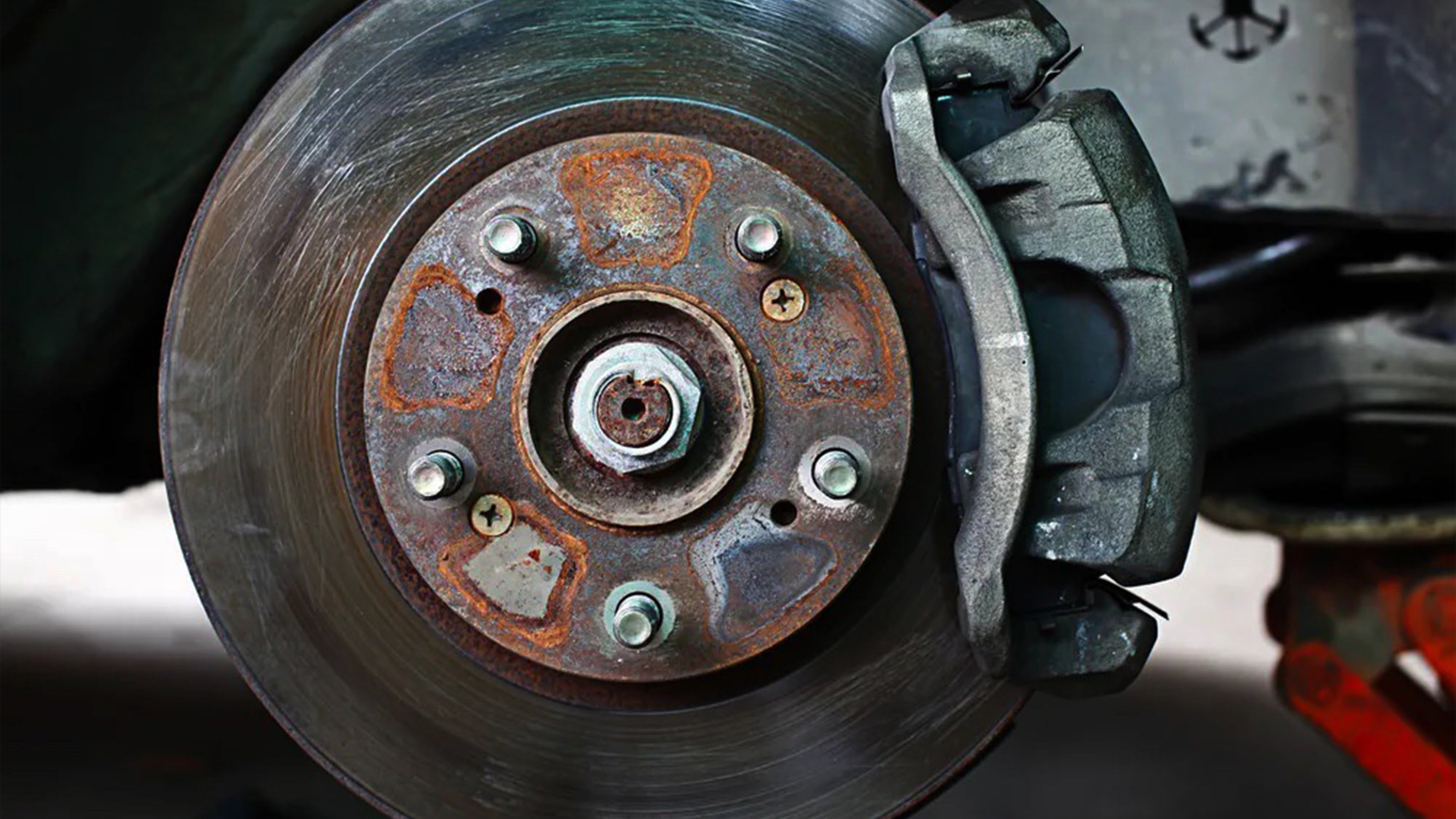 Close-up of warped brake rotor on vehicle wheel
