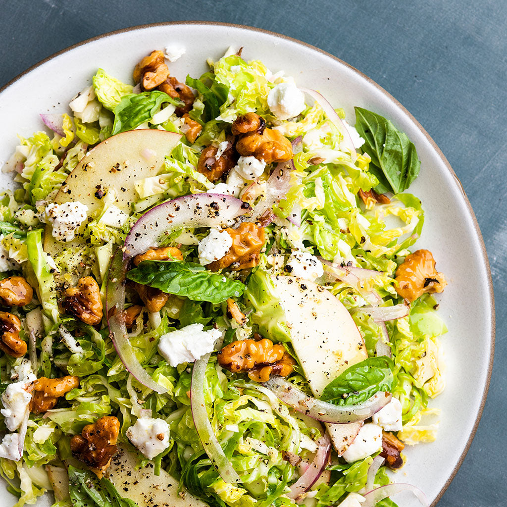 Shaved Brussels Sprouts with Fuji Apple, Goat Cheese, Walnuts and Basil Vinaigrette