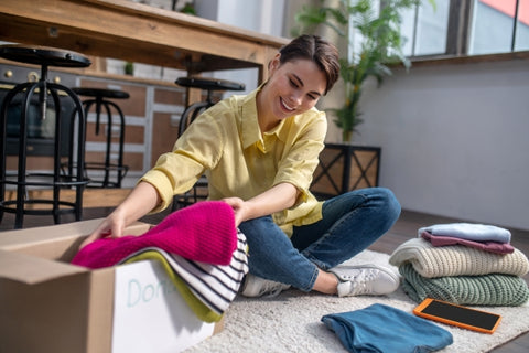 decluttering house using storage boxes