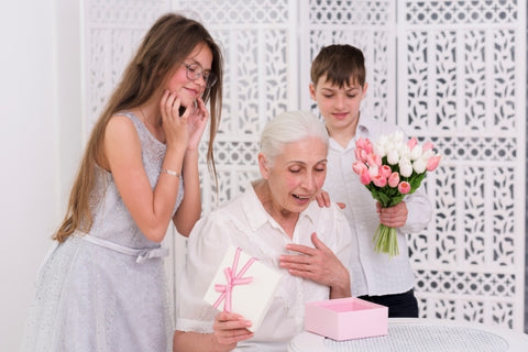 smiling-boy-girl-standing-surprised-grandmother