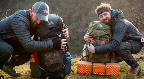 two campers with backpacks