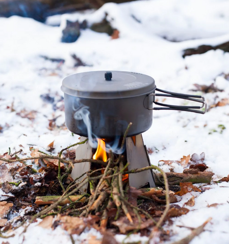 Camping cooking pot over camp fire