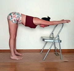 ardha uttanasana on yoga chair