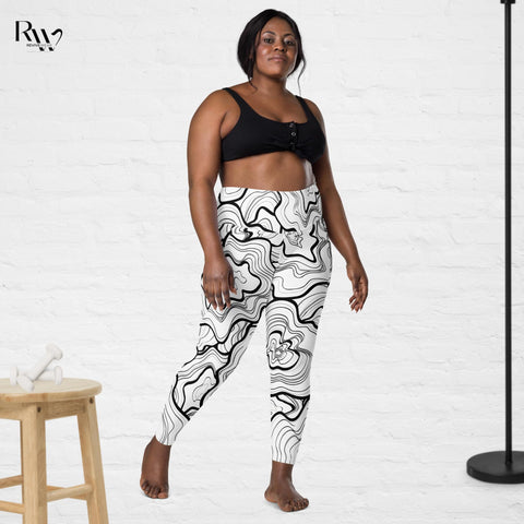 Model wearing plus size fitness leggings with phone pocket in a black and white print