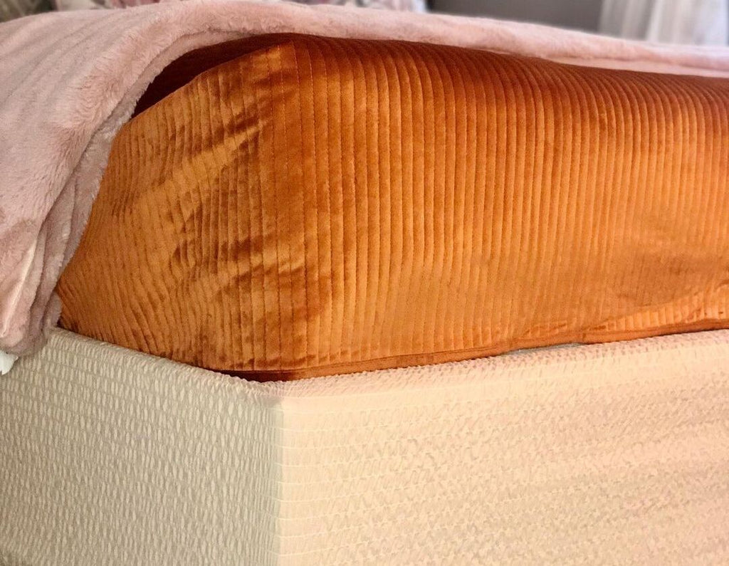 orange bedspread and microfiber cream