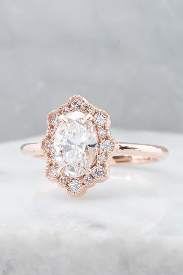 White Oval Engagement Ring with Unique Halo
