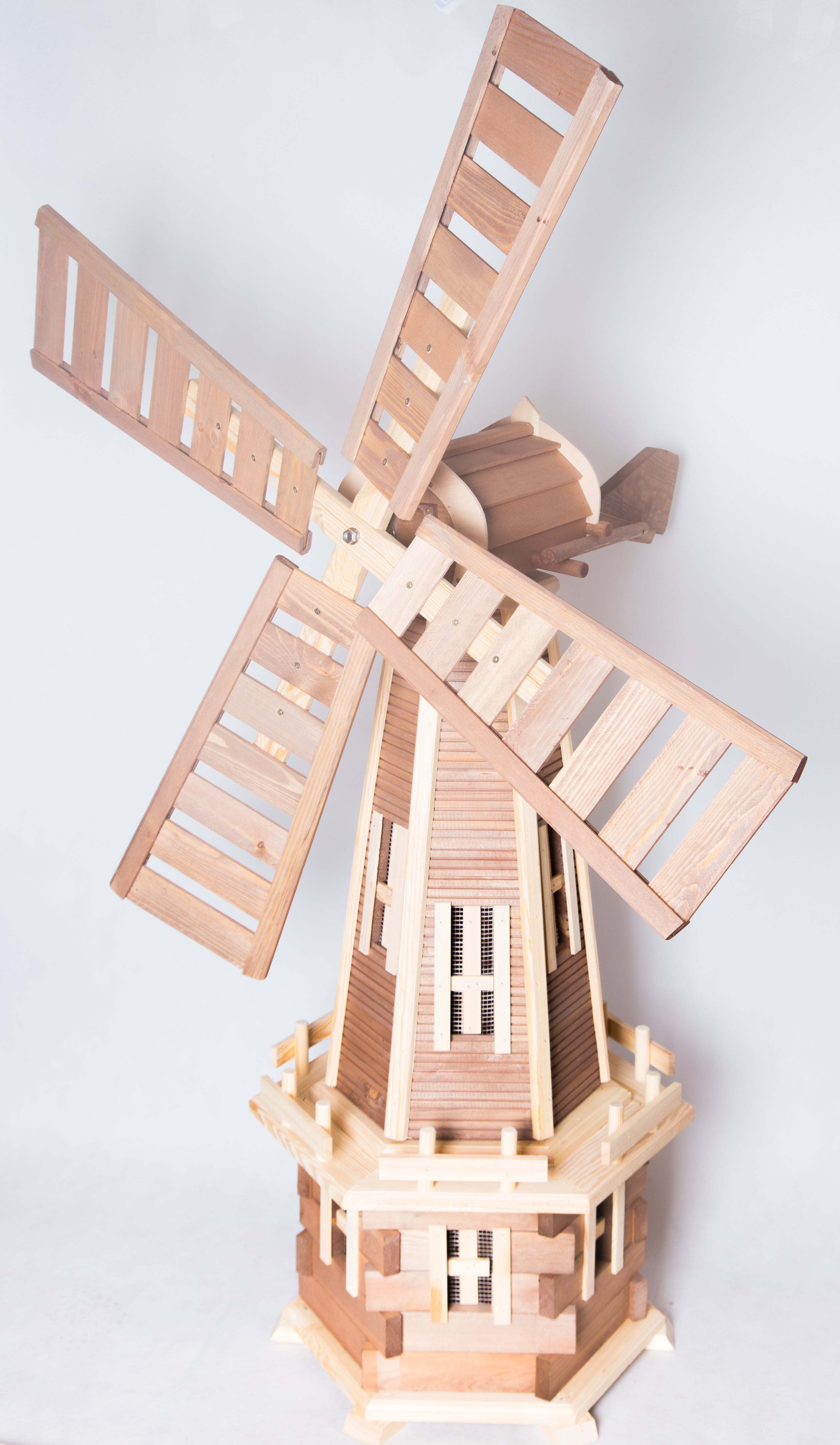 An array of garden windmills in various sizes and designs, enhancing outdoor aesthetics with their spinning blades and artistic appeal from Pendle Windmills