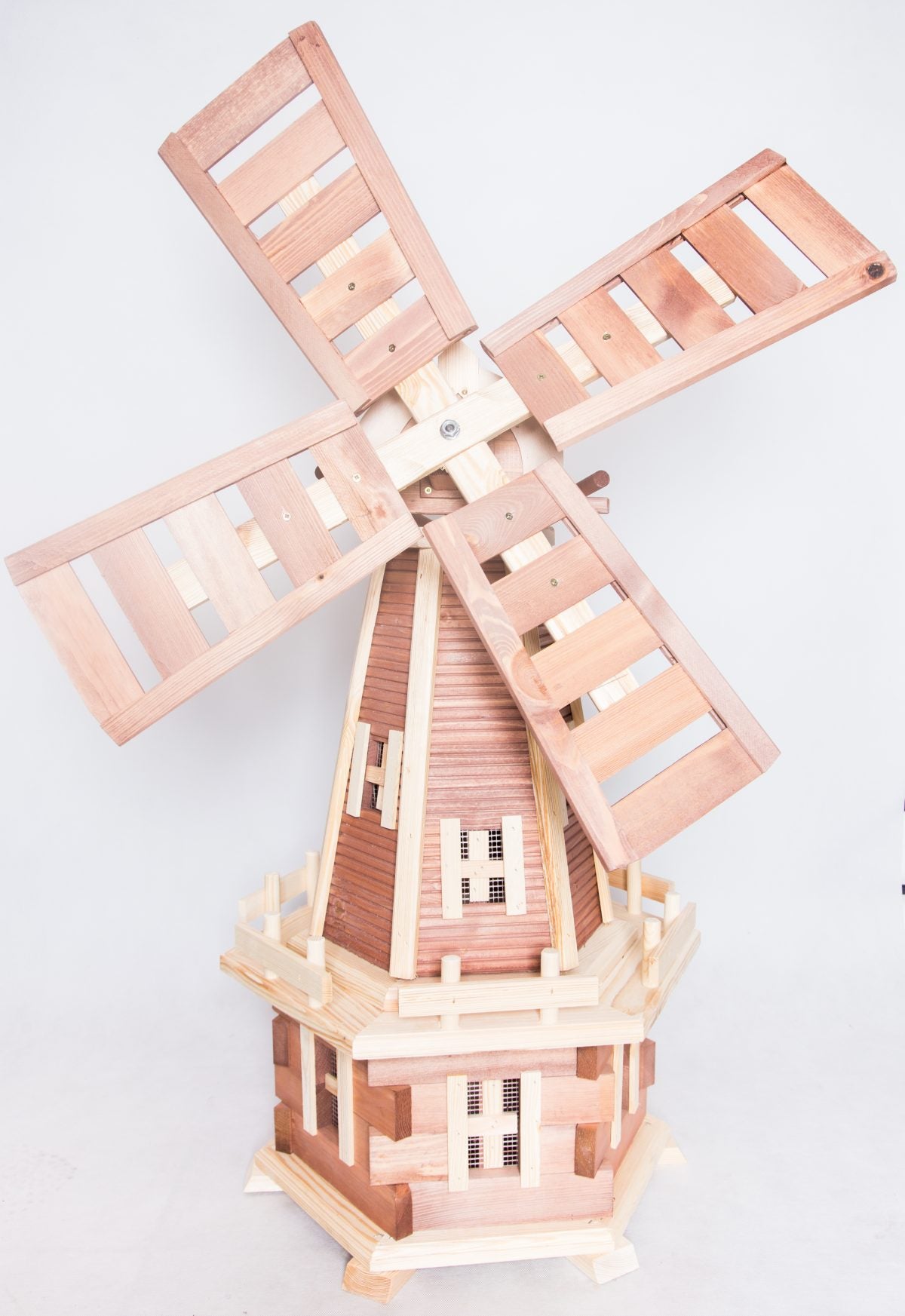 Handcrafted wooden windmill - a charming garden ornament with rotating blades, adding rustic elegance and movement to your outdoor space