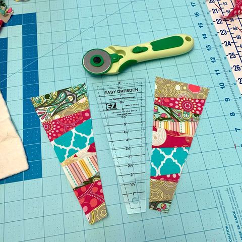 Fabric pieces cut with wedge shape template and rotary cutter