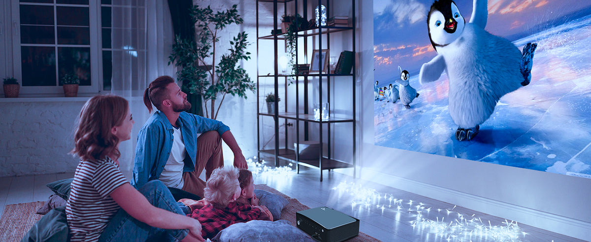Family using PJ20 projector, enjoying a vivid and clear animated movie about the Penguin family
