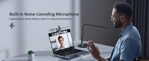 A man is using the N60 Pro camera for a video call, utilizing its built-in noise-canceling microphone